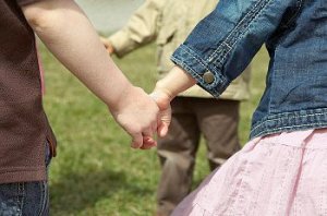 Kids holding hands on playground